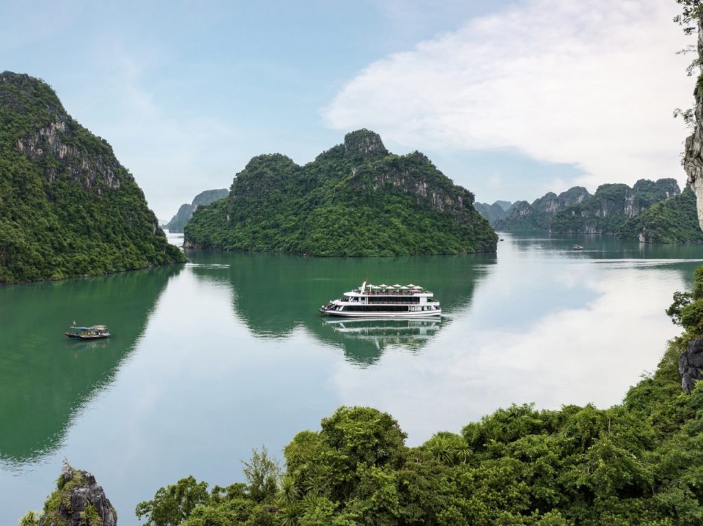Stunning Halong Bay scenery with emerald waters and limestone islands, perfect for a luxurious cruis.