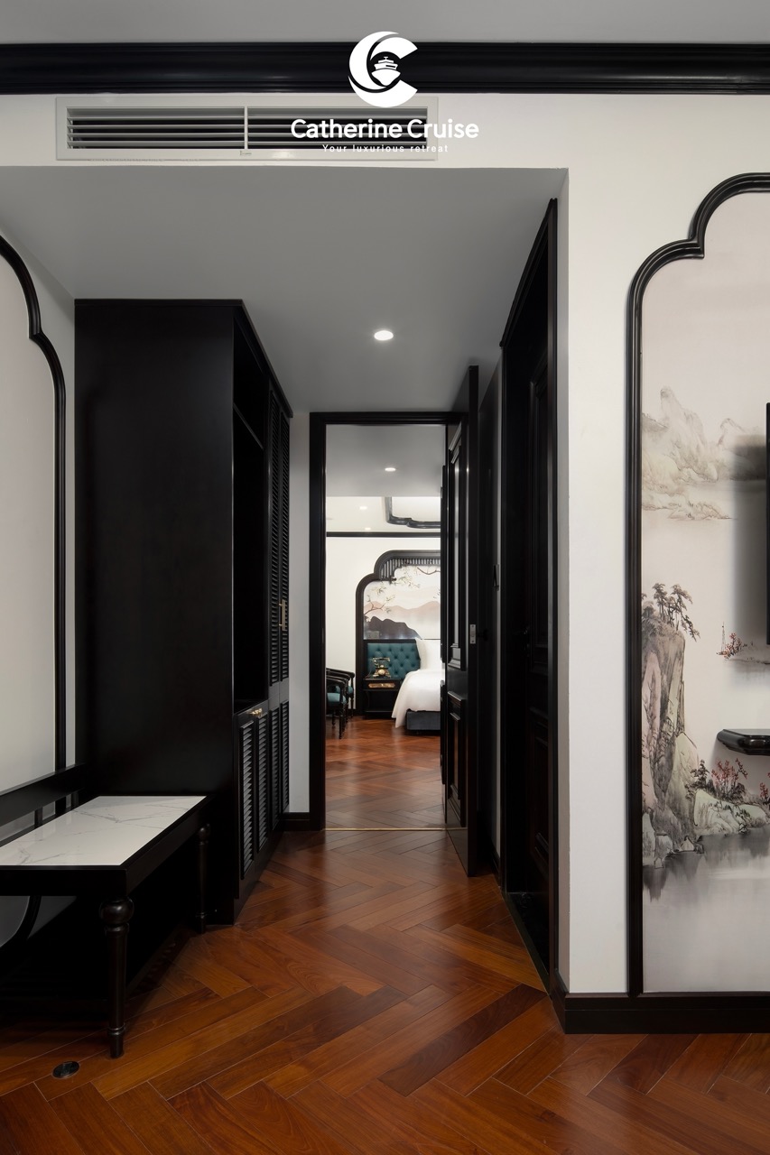 Elegant hotel corridor with traditional Asian artwork and a view into a luxurious bedroom, perfect for sophisticated travelers.