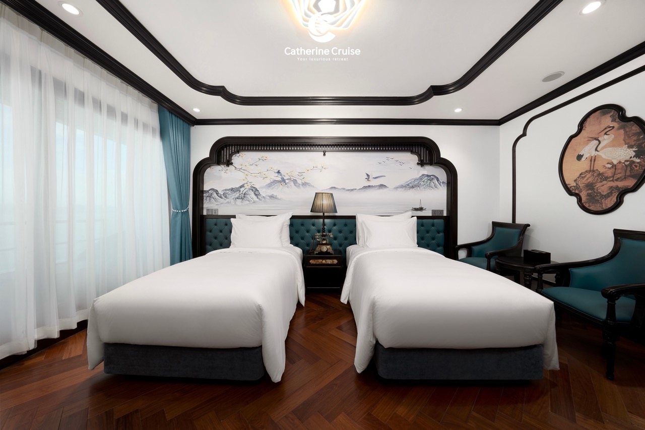 Luxury cruise cruise cabin with twin beds, elegant Asian-themed decor, and panoramic window views.