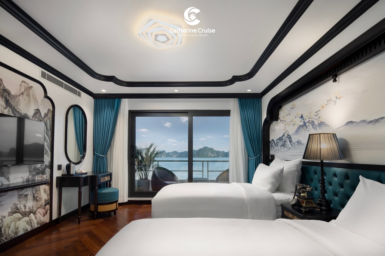 Luxury hotel room with ocean view, modern decor, and balcony in Vietnam.