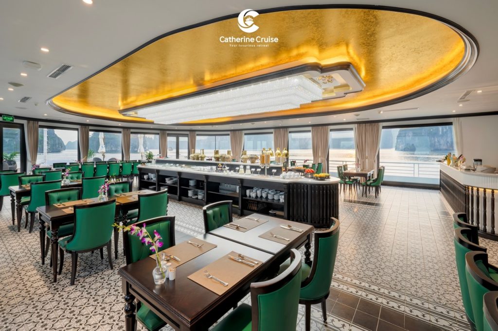Elegant cruise restaurant with ocean views, luxurious decor, and fine dining setup.