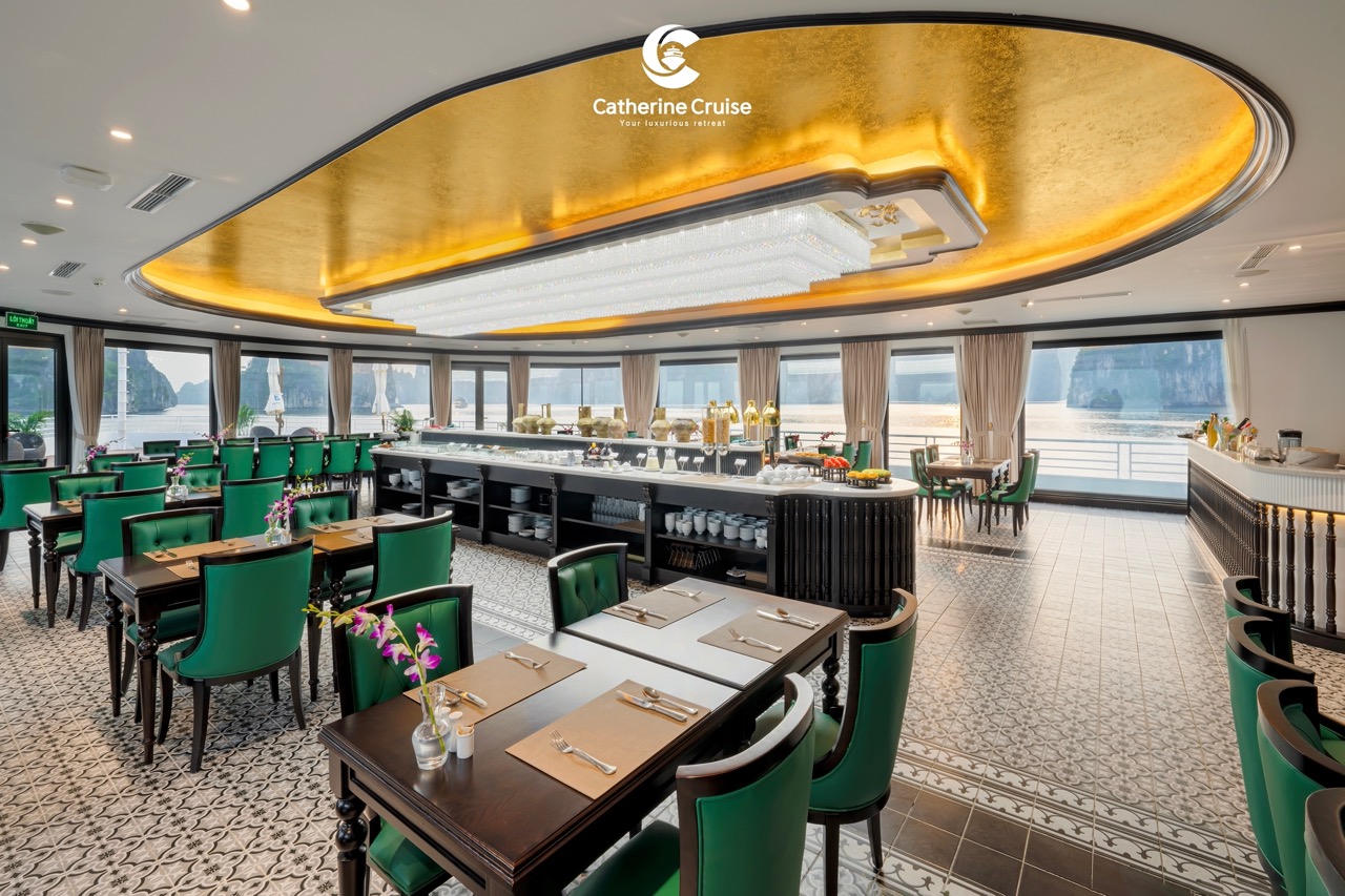 Elegant cruise restaurant with ocean views, luxurious decor, and fine dining setup.