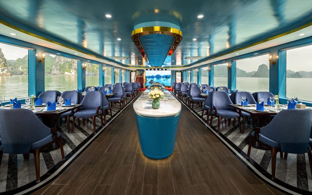 Elegant cruise interior with panoramic views of Halong Bay, perfect for a luxurious day trip.
