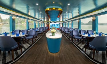 Elegant cruise interior with panoramic views of Halong Bay, perfect for a luxurious day trip.