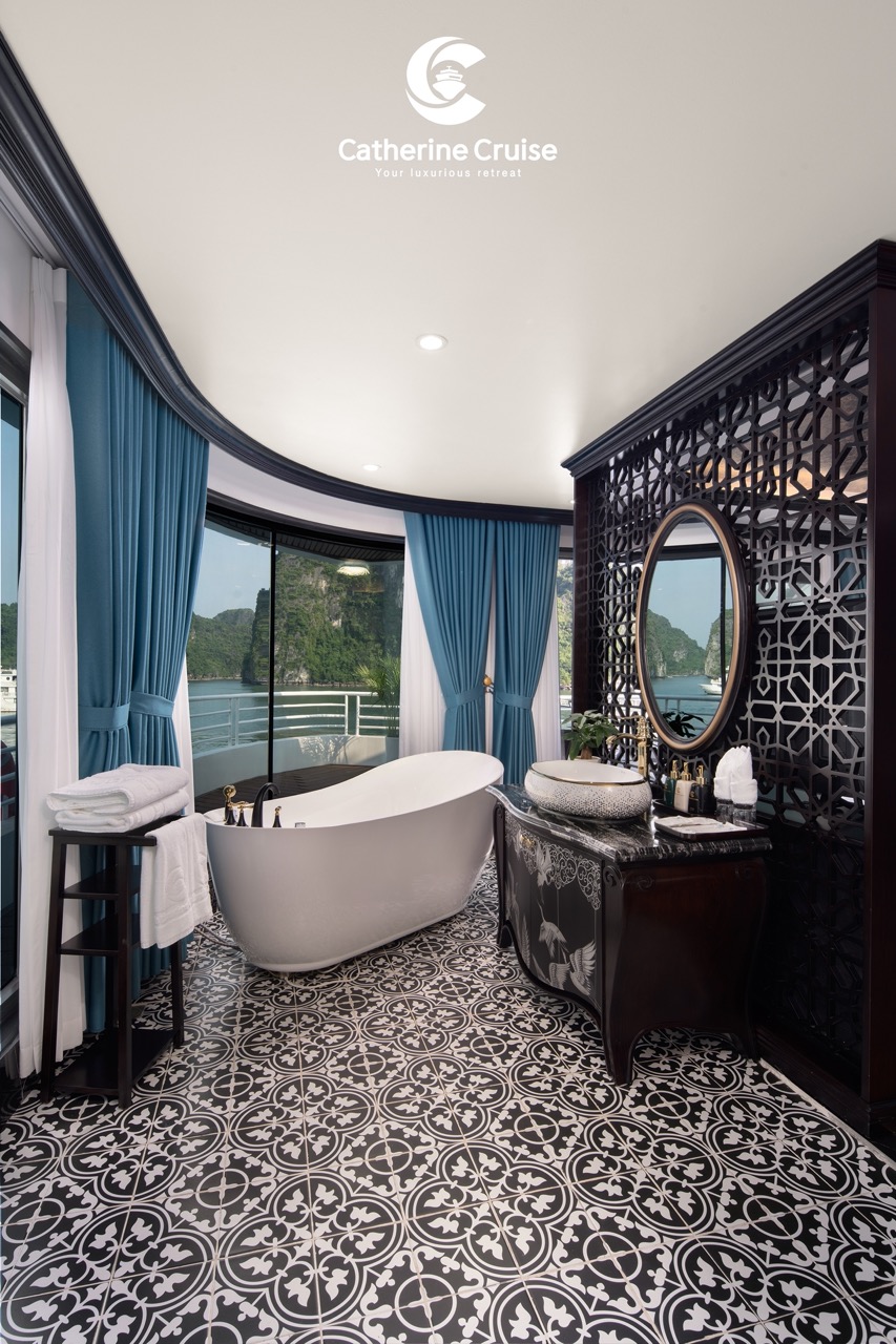 Luxury cruise bathroom with elegant bathtub and scenic bay view in Vietnam, perfect for premium travel experiences.