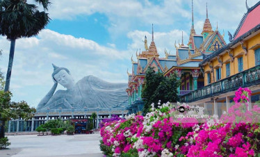 Mekong Delta temple with colorful flowers and traditional architecture, perfect for cultural explora.