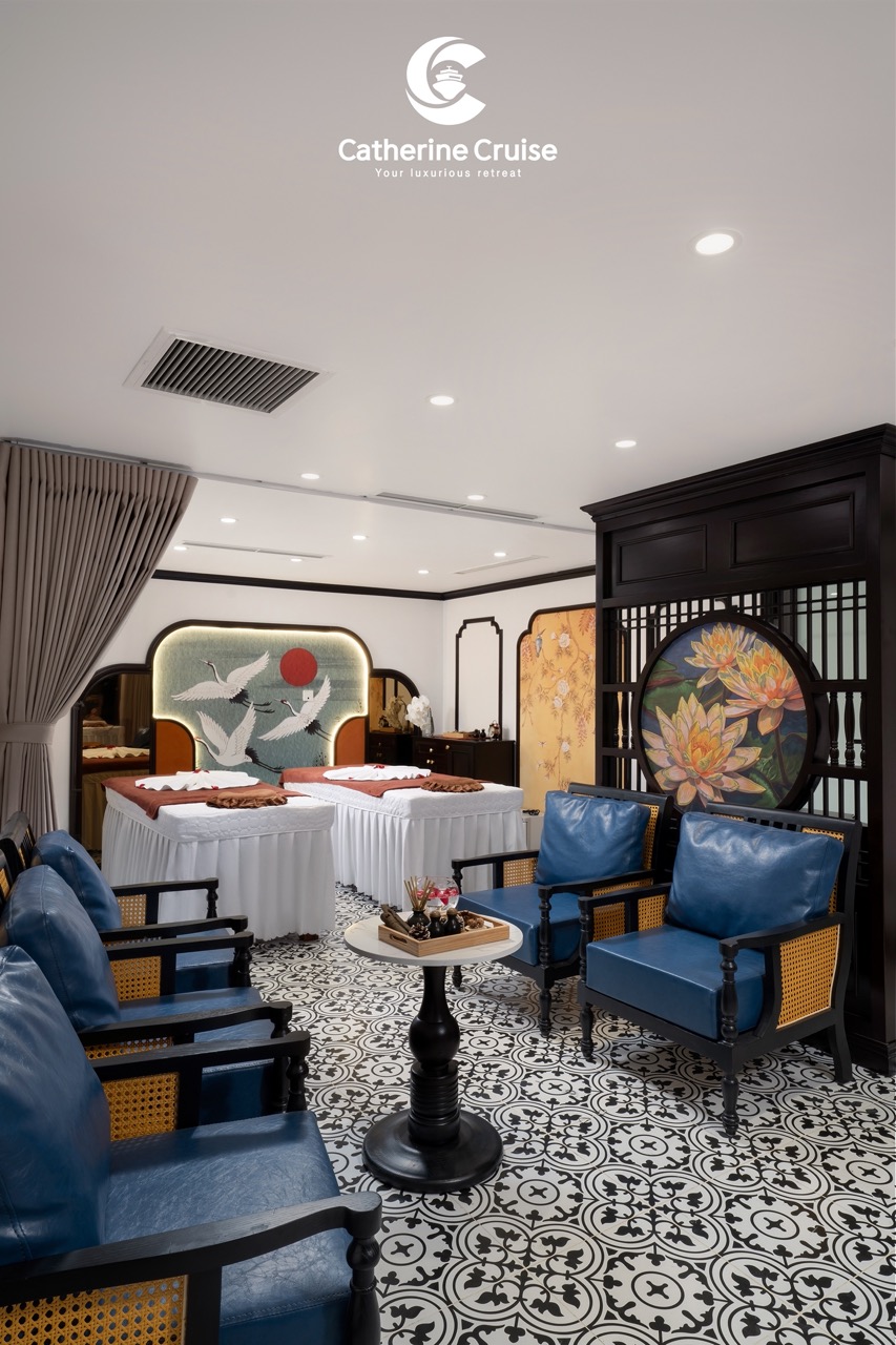 Elegant interior of a luxurious cruise cabin at ViettrendTour, featuring traditional Asian design elements and comfortable seating.
