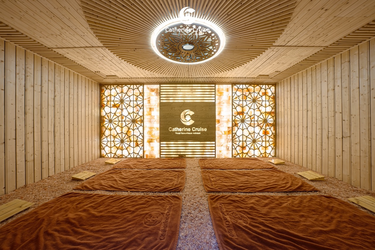 Relaxing spa room with warm lighting and wooden decor at ViettrendTour’s luxury retreat.
