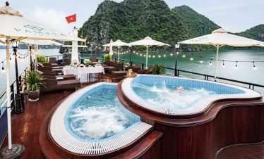 Stunning Halong Bay cruise balcony with panoramic water views and luxurious amenities. Perfect for a.