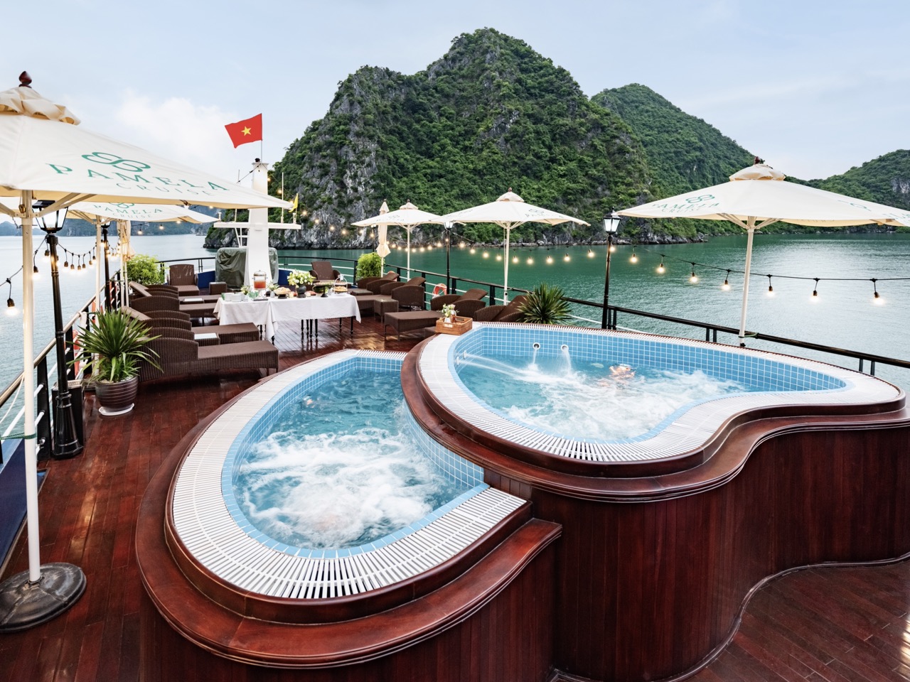 Stunning Halong Bay cruise balcony with panoramic water views and luxurious amenities. Perfect for a.