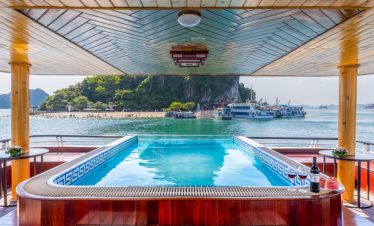 Relaxing pool with scenic Halong Bay view from Heritage Cruise, perfect for a tranquil vacation expe.