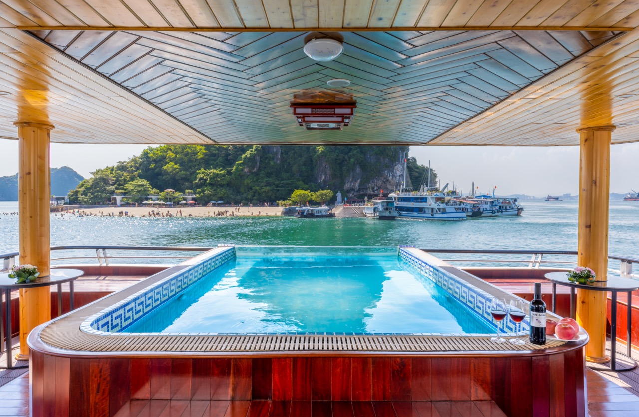 Relaxing pool with scenic Halong Bay view from Heritage Cruise, perfect for a tranquil vacation expe.