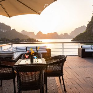 Sundeck seating with umbrellas and panoramic bay views.