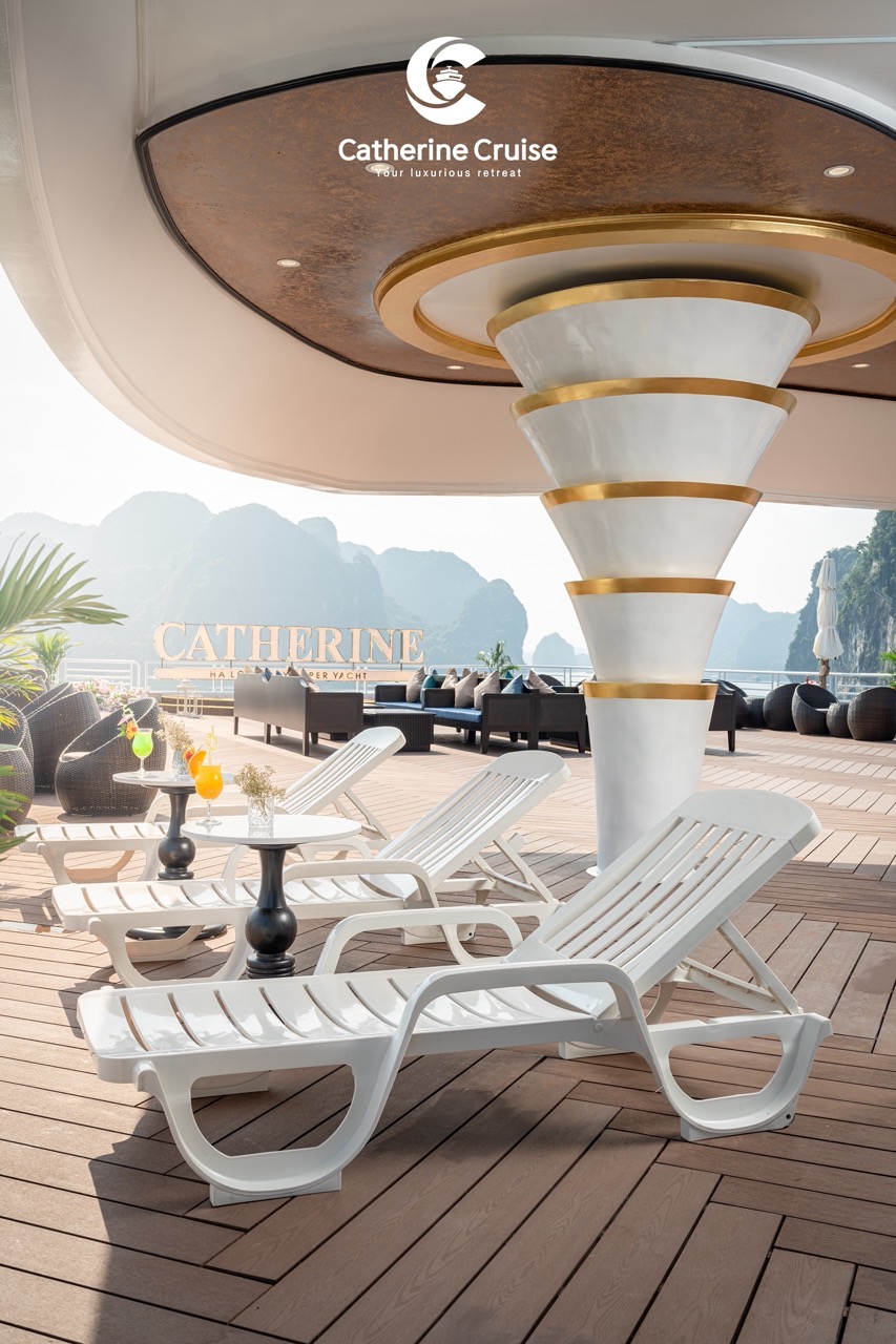 Elegant yacht deck with lounge chairs and scenic mountain views for luxury cruising.