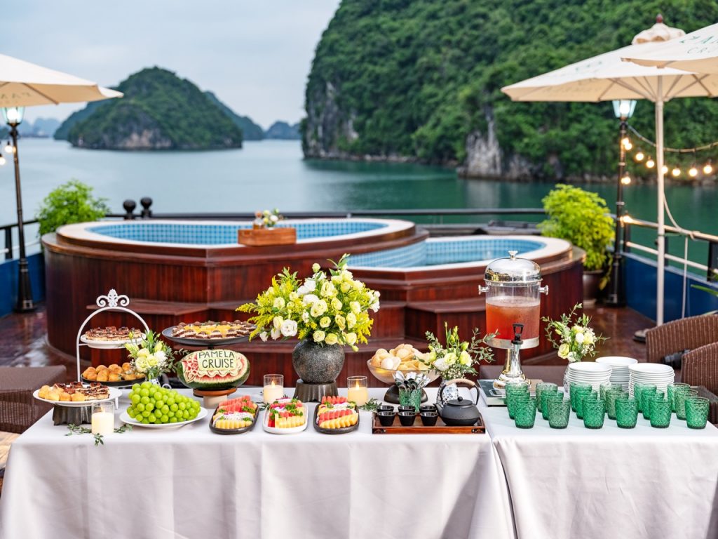 Scenic Halong Bay cruise balcony with lush islands and tranquil waters, perfect for a luxurious trav.