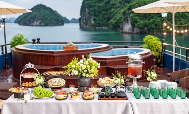 Scenic Halong Bay cruise balcony with lush islands and tranquil waters, perfect for a luxurious trav.