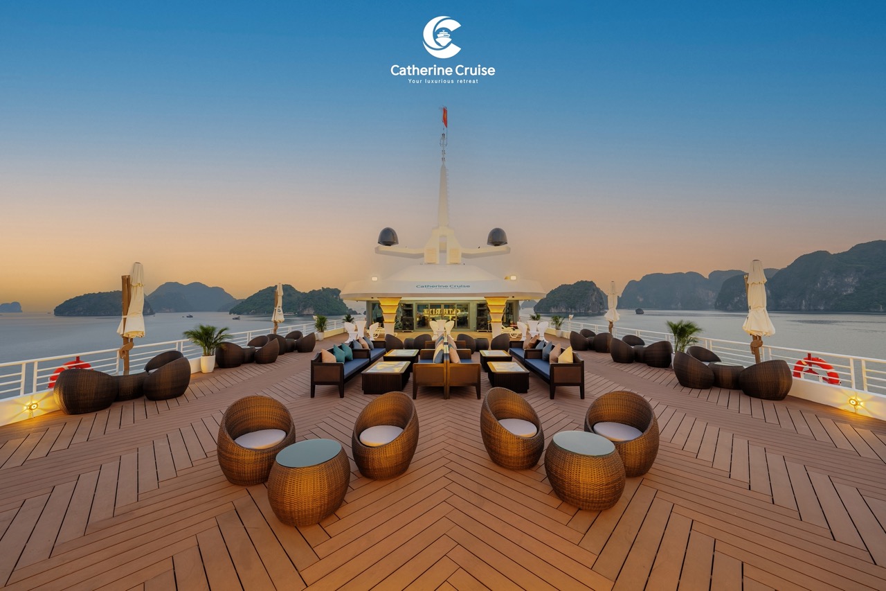 Luxurious yacht deck with outdoor seating and scenic ocean views at sunset, premium cruise experience.