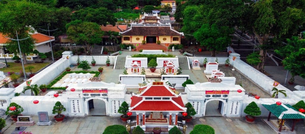 Ancient temple surrounded by lush greenery, offering a peaceful cultural experience.