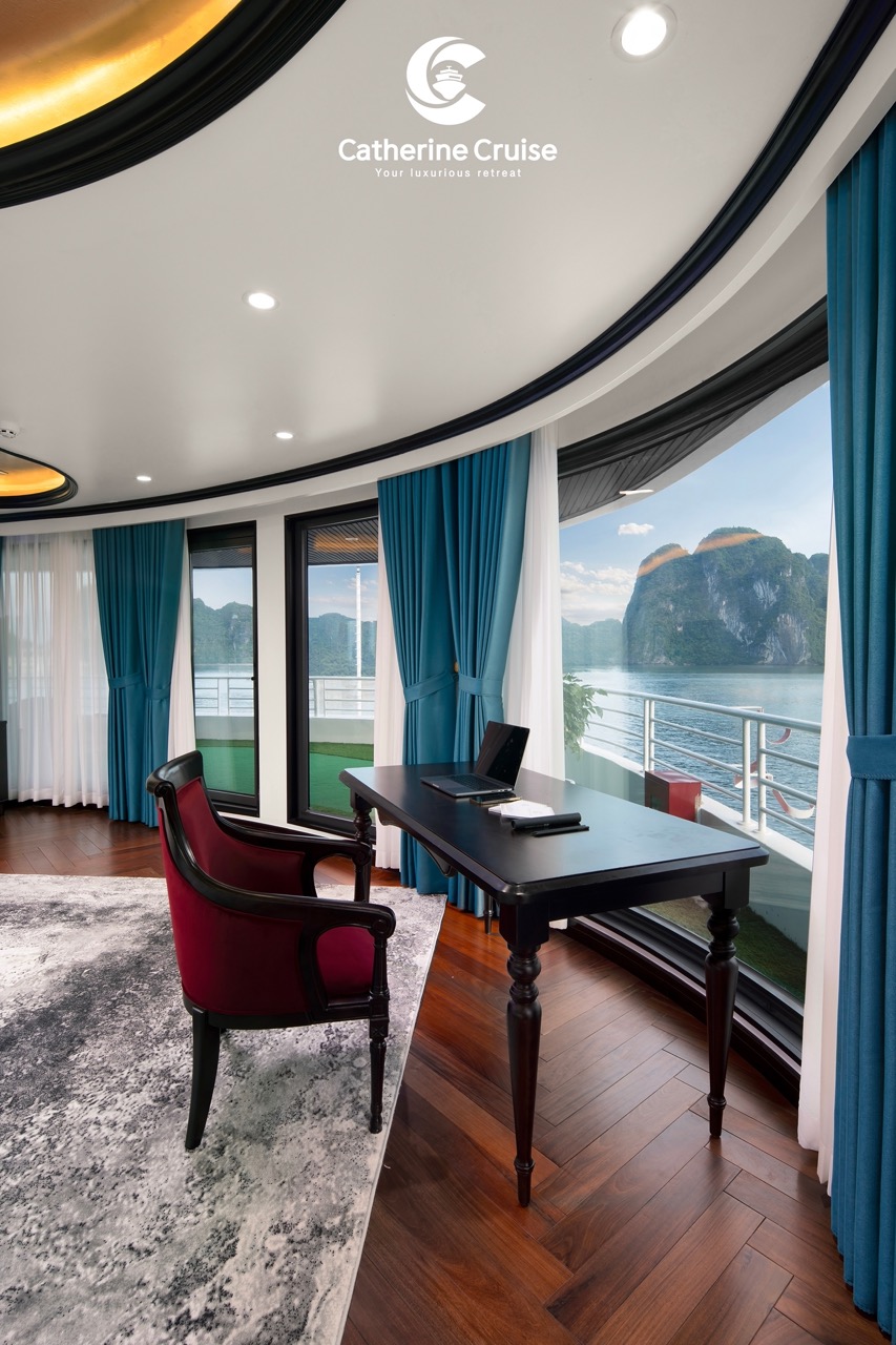 Luxury cruise ship interior with ocean view and modern furnishings.
