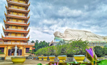Pagoda and Reclining Buddha Statue in Vietnam's Mekong Delta, a serene spiritual site.