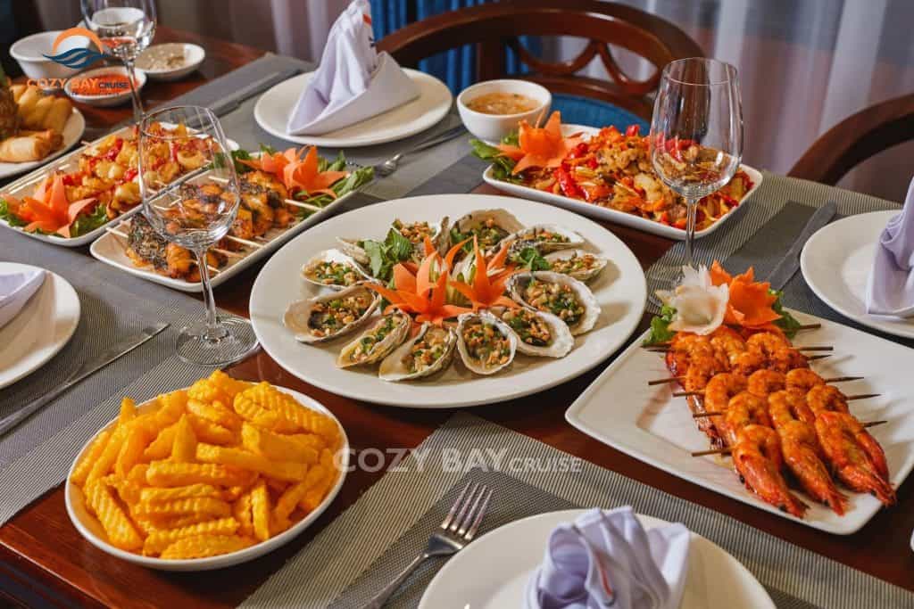 Seafood platter and local dishes on luxury cruise.