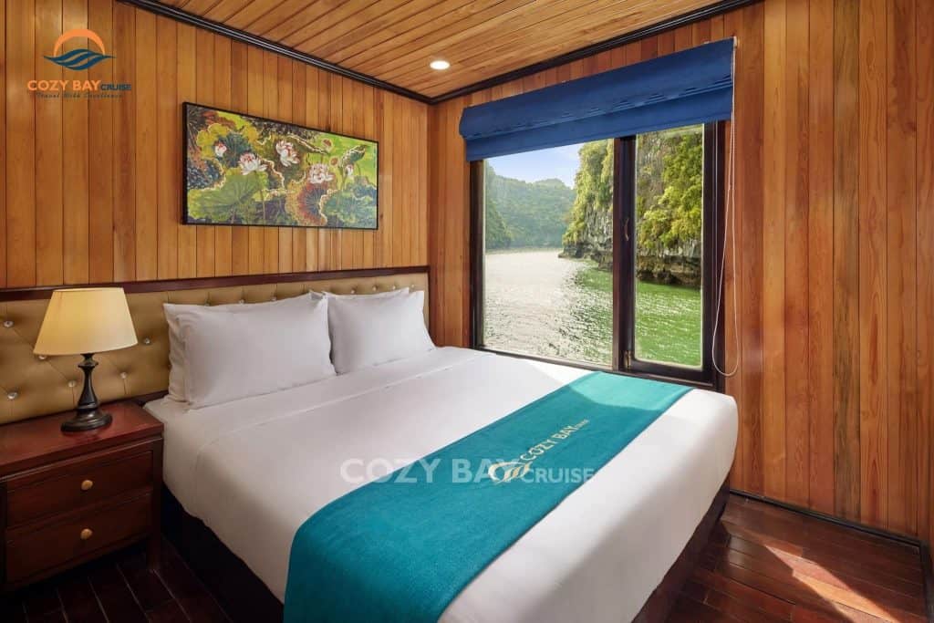 Cozy Bay Cruise room with scenic view of Halong Bay, perfect for a relaxing getaway.