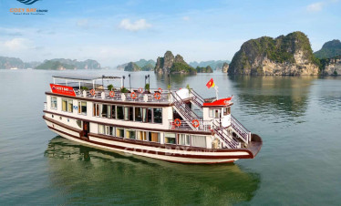 Cozy Bay cruise boat sailing through stunning Halong Bay scenery, offering a luxurious experience on.