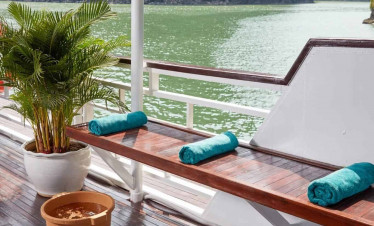 Relaxing bay view with lush green mountains and calm waters.