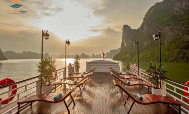 Cozy bay cruise deck with scenic view of limestone karsts at sunset, relaxing and luxurious experien.