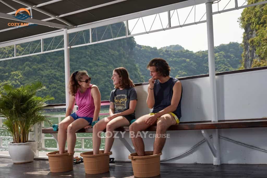 Relaxing on the deck with friends in Halong Bay.
