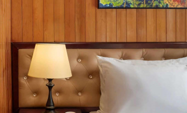 Cozy Bay Cruise luxurious room with warm lighting and elegant decor, perfect for a relaxing Halong B.