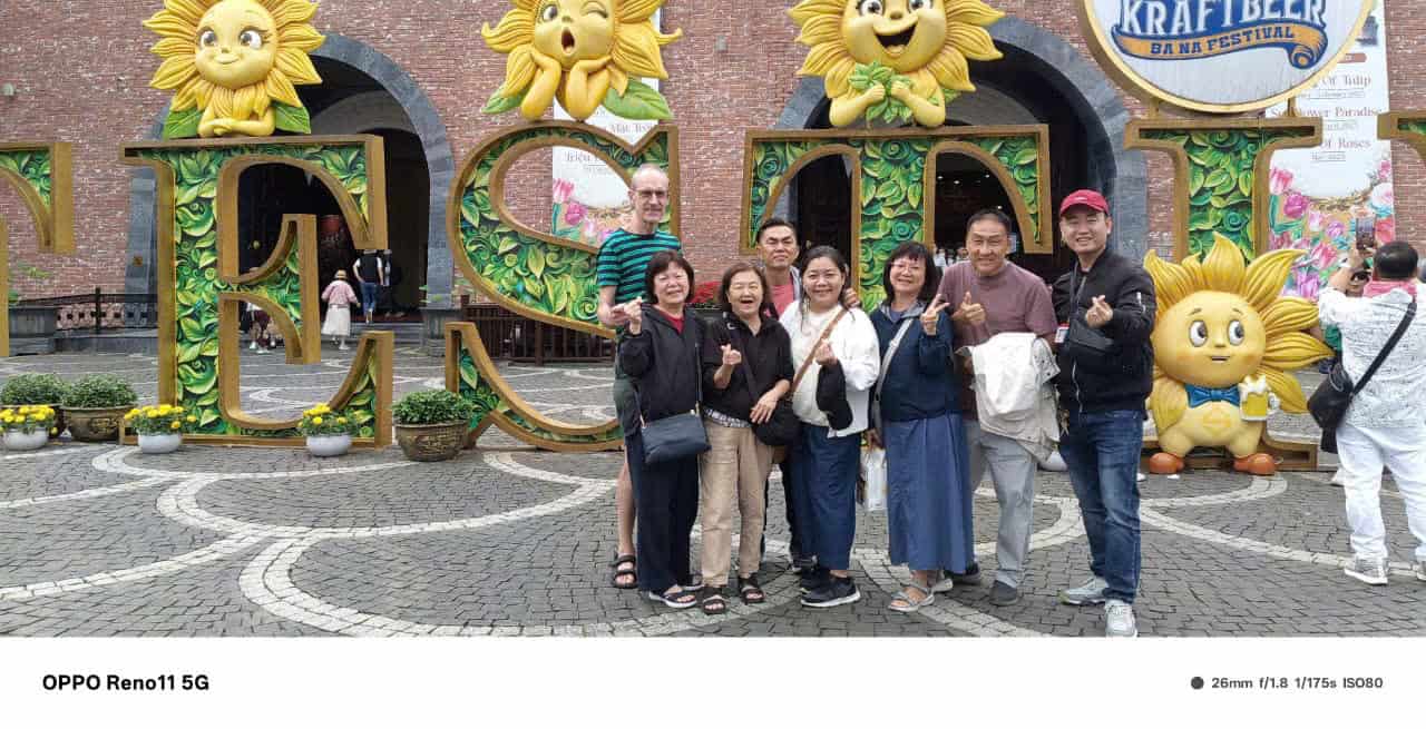 Sunflower park with cheerful visitors enjoying vibrant floral scenery in Vietnam.