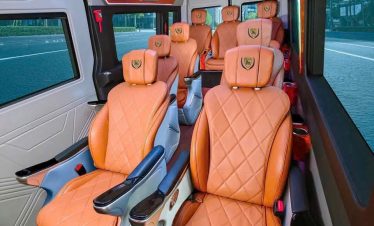 Luxury van interior with comfortable leather seats for Hanoi to Sapa transfer.