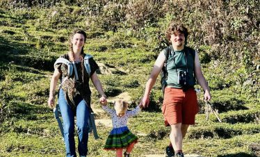 Hiking adventure with family in lush Sapa mountains, experiencing Vietnam's natural beauty.