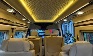 Luxury van interior with plush seats and ambient lighting for a comfortable Sapa transfer.