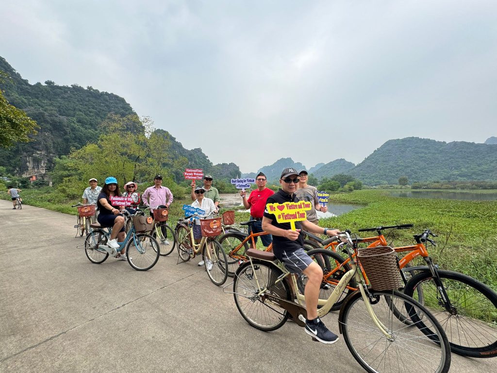 Cycling along scenic paths in Halong Bay, experiencing breathtaking views and fresh air.