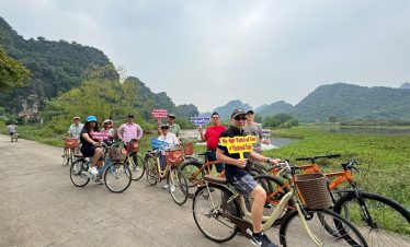 Cycling along scenic paths in Halong Bay, experiencing breathtaking views and fresh air.
