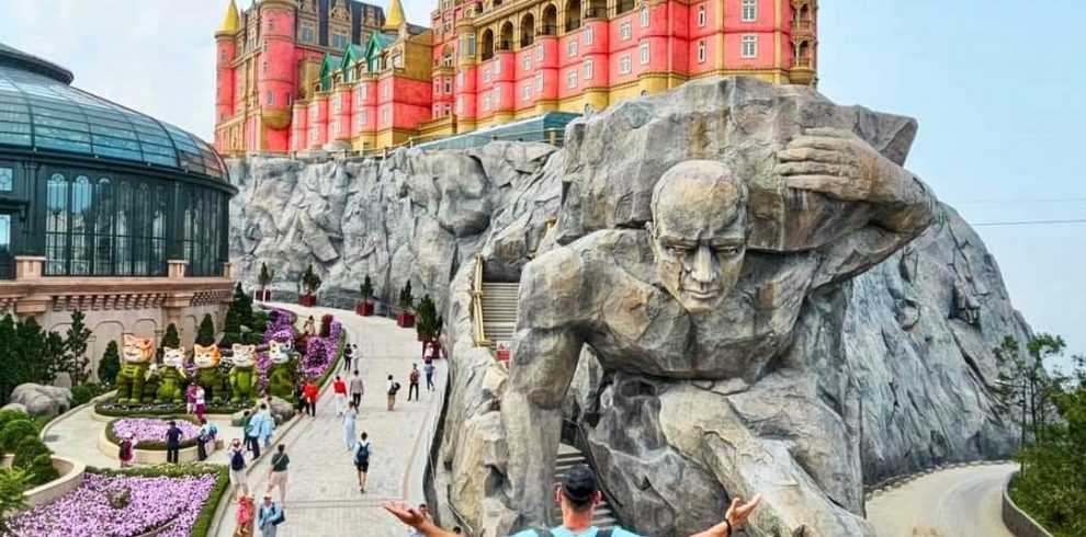 Castle Hill Theme Park attraction in Vietnam with a giant sculpture and colorful castle.