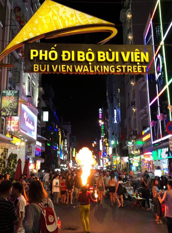 Bui Vien Walking Street bustling nightlife scene with vibrant lights and lively crowd.