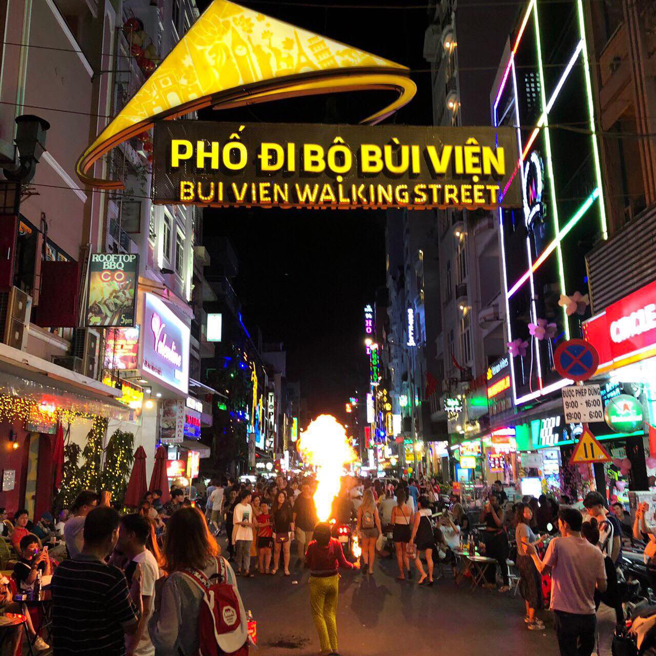 Bui Vien Walking Street bustling nightlife scene with vibrant lights and lively crowd.