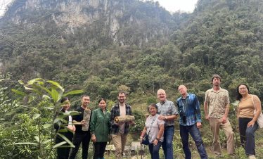 Explore stunning mountain scenery with a vibrant group tour in Vietnam.
