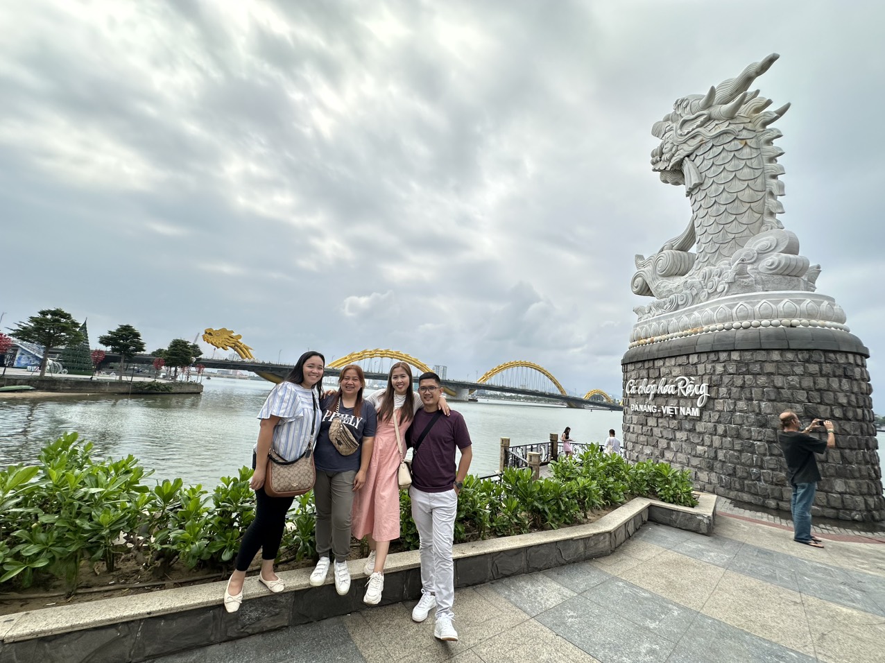 Dragon statue overlooking the river in Hanoi, symbolizing strength and cultural heritage.