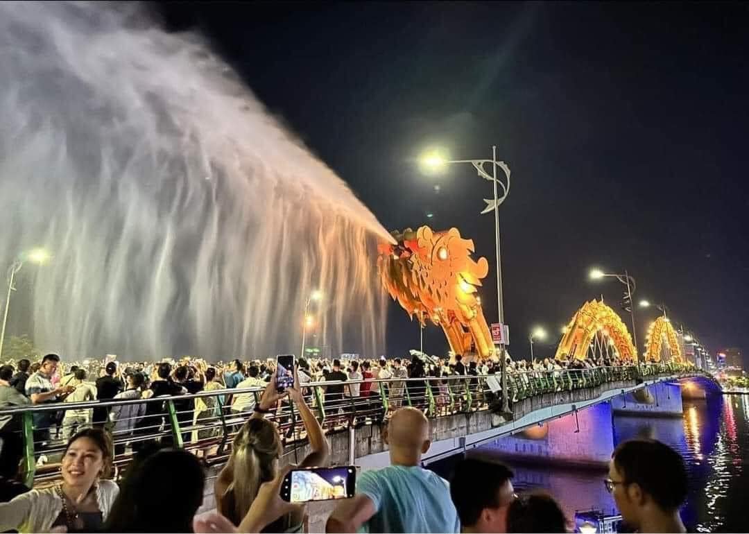 Danang Tours - Dragon Bridge illuminated with fire and water display in Da Nang, Vietnam.