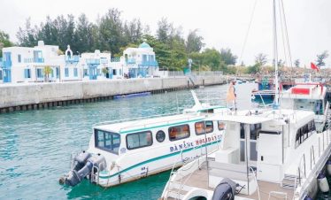 Luxury boat cruising in Halong Bay with stunning limestone karsts.