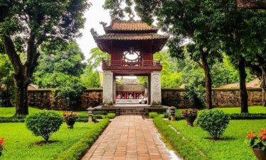Vietnam Cultural Pavilion in lush garden setting, traditional architecture, serene atmosphere.