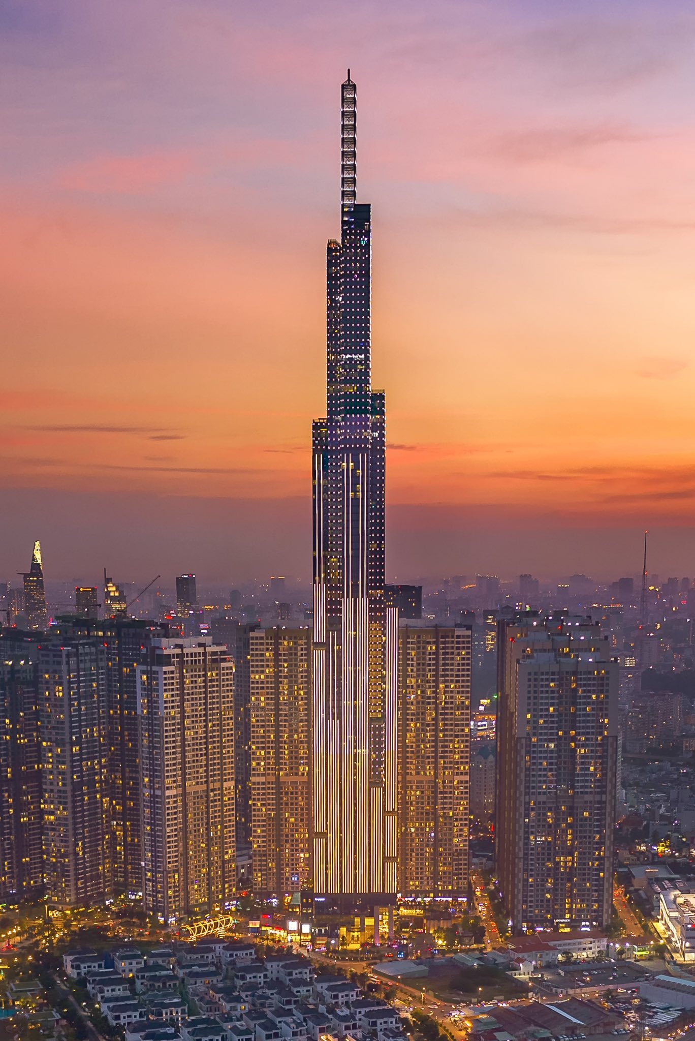 Burj Khalifa towering over Dubai's skyline at sunset, showcasing luxury and modernity.