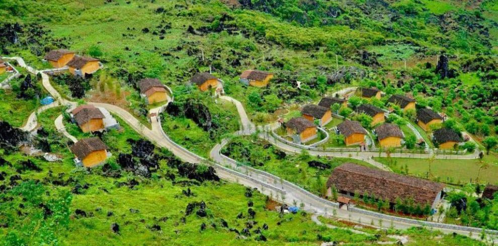 Village trekking adventure through lush green hills in Vietnam.