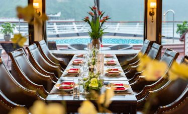 Luxurious cruise dining experience overlooking Lan Ha Bay in Vietnam, perfect for a memorable getawa.
