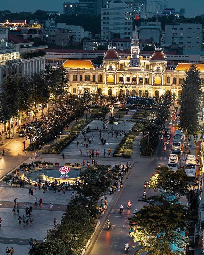 Ho Chi Minh City City Hall illuminated at night, showcasing colonial architecture and vibrant city l.