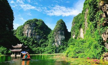 Scenic Lan Ha Bay landscape with lush green karst mountains and tranquil waters, perfect for a luxur.